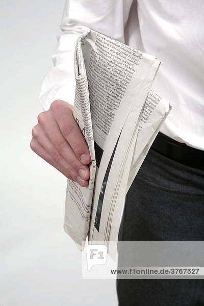 Man with newspaper in the hand