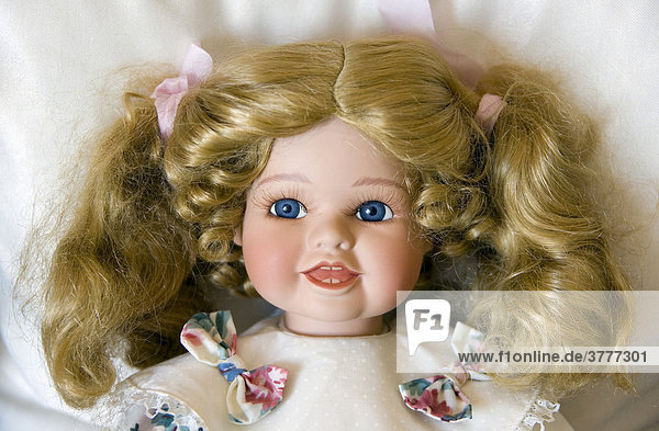 The head of a blond doll - close up