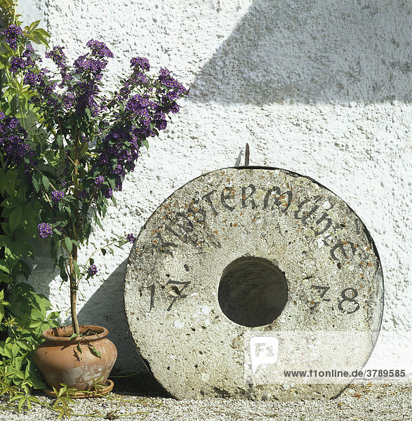 Obermühltal Obermuelthal near Dietramszell Upper Bavaria Germany old millstone dated 1778 originally from the monastery mill