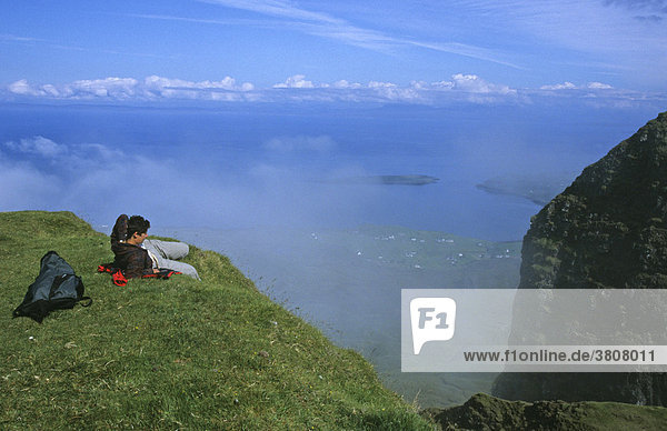 Hiker enjoys the view from the Table a mountain in the Quiraing  Trotternish  Island of Skye  Scotland