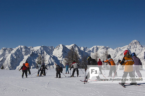 Kids are learning to ski in the mountains