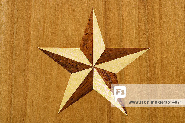 Intarsia  star out of nut tree and maple wood in cherrywood