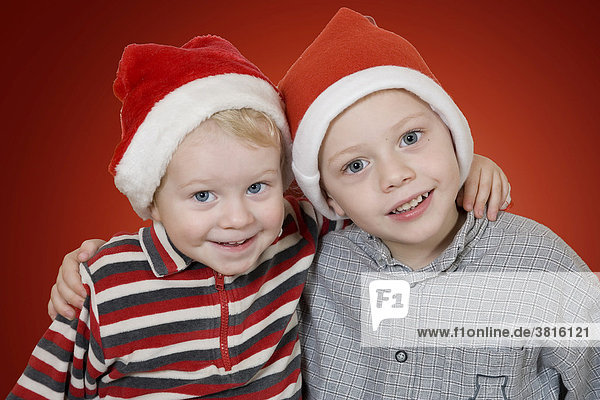 Two little boys with X-Mas caps