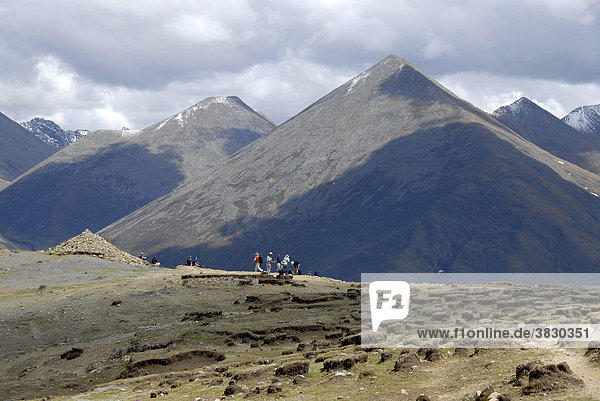 Trekking group on the old pilgrim path through high mountains from Ganden Monastery to Samye Tibet China