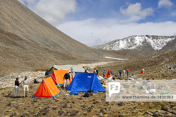 Trekking group sets camp of tents below Shug-La Pass Tibet China