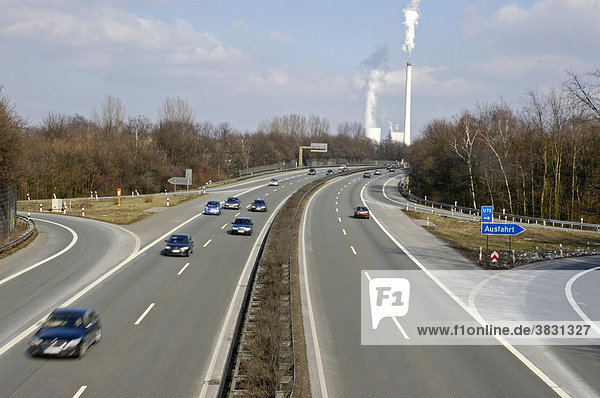 Cars on the autobahn in front of smoking chimneys traffig Ruhr Area Ruhr Basin Gelsenkirchen Nordrhein Westphalia Ruhr district Germany
