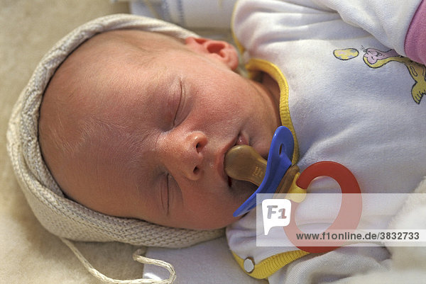 Newborn sleeping with pacifier MR
