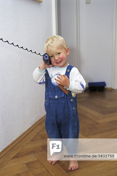 Two-year-old boy phoning MR