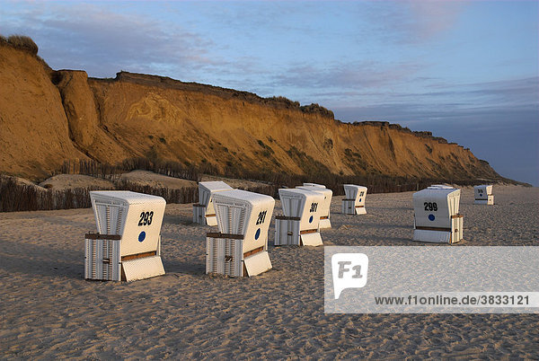 Beach chairs in front at cliff Rotes Kliff near Kampen at dusk  Sylt  Schleswig Holstein  Germany