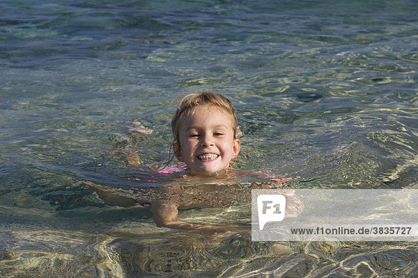 Little girl swimming  Sardinia  Italy