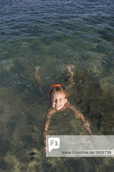 Little girl swimming  Sardinia  Italy