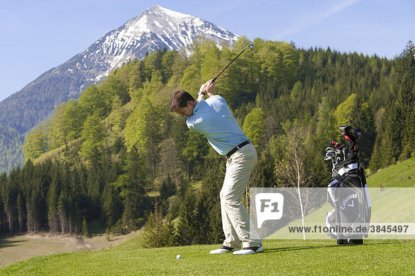 Golfer at tee off  alpine golf course  Achenkirch  Tyrol  Austria  Europe