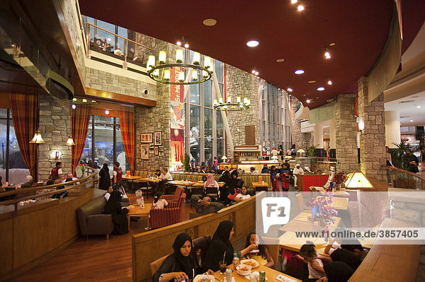Ski restaurant in the Mall of the Emirates  with local restaurant guests  Dubai  United Arab Emirates  Middle East