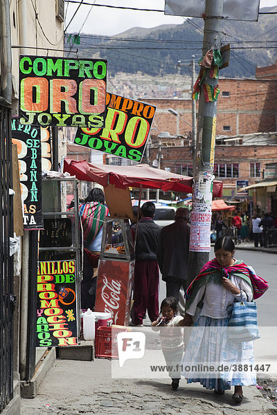 Mother and child in typical street scene  La Paz  Bolivia  South America