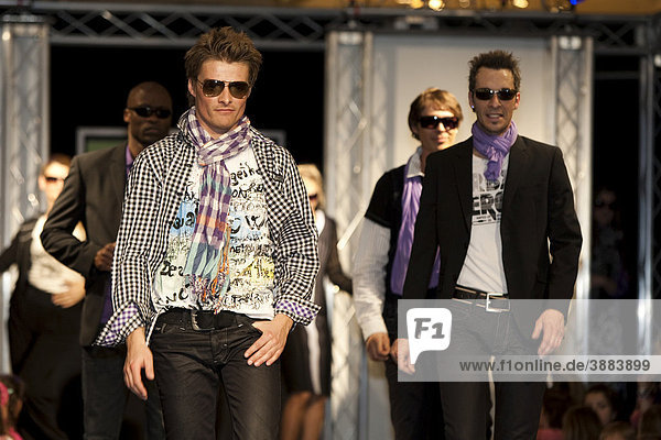 Male models in a fashion show in the Emmencenter shopping center in Emmenbruecke  Lucerne  Switzerland