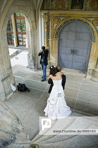 Wedding photos on the famous cantilevered stairs  Grosser Wendelstein  in Schloss Hartenstein castle  Torgau  Saxony  Germany  Europe