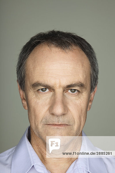Mature man with serious expression on face  portrait