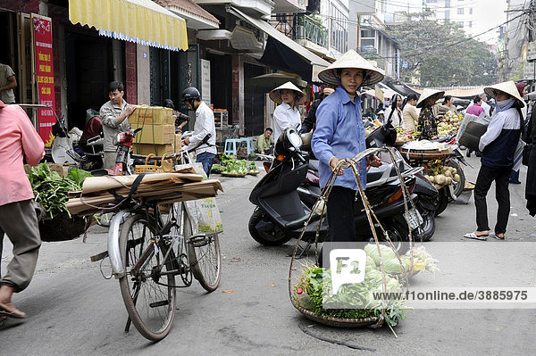 Street scene with woman selling vegetables  Hanoi  North Vietnam  Vietnam  Southeast Asia  Asia