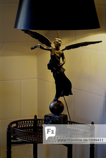 Antique lamp with a bronze angel in the Empire style