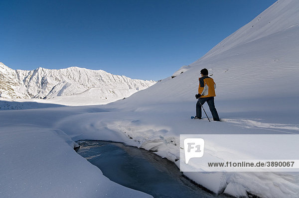 Man walking with snowshoes  Rifflsee  Pitztal  Tyrol  Austria  Europe
