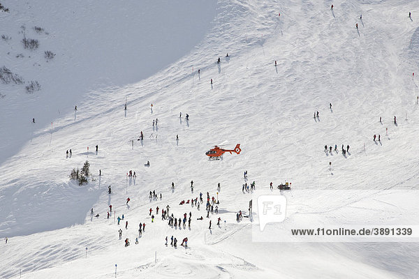 Air rescue with helicopter on Mt Fellhorn  skiing accident  winter  snow  Oberstdorf  Allgaeu Alps  Allgaeu  Bavaria  Germany  Europe