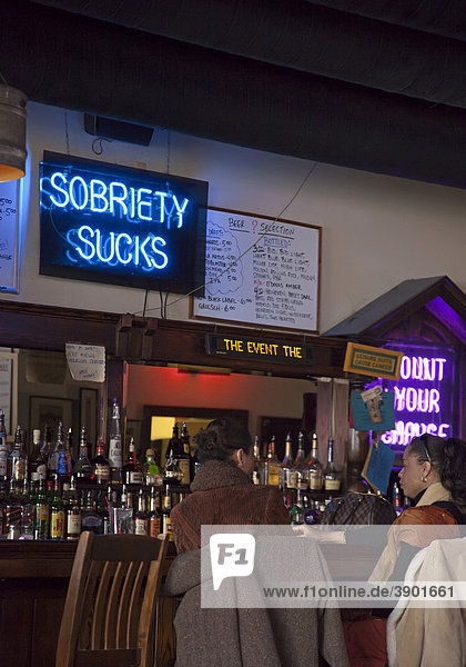 A sign reads Sobriety Sucks at Honest John's Bar and No Grill  Detroit  Michigan  USA
