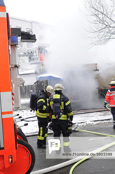 Fire brigade extinguishing a fire  Stuttgart  Baden-Wuerttemberg  Germany  Europe