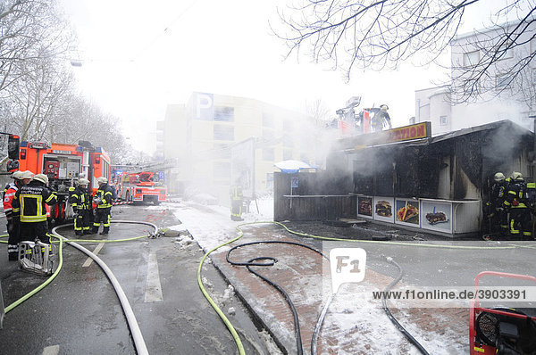 Fire brigade extinguishing a fire in a burnt-out snack stand  Stuttgart  Baden-Wuerttemberg  Germany  Europe