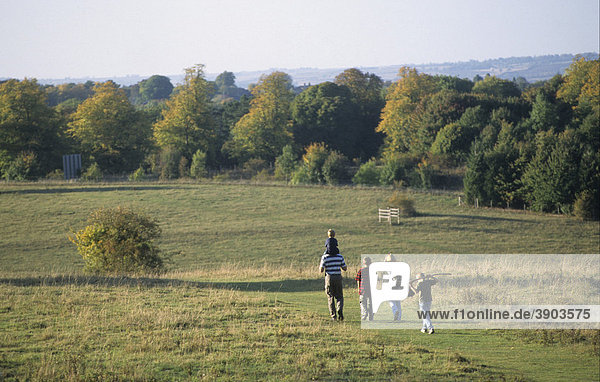 Family walking in parkland  Tring Park  Tring  Hertfordshire  England  United Kingdom  Europe