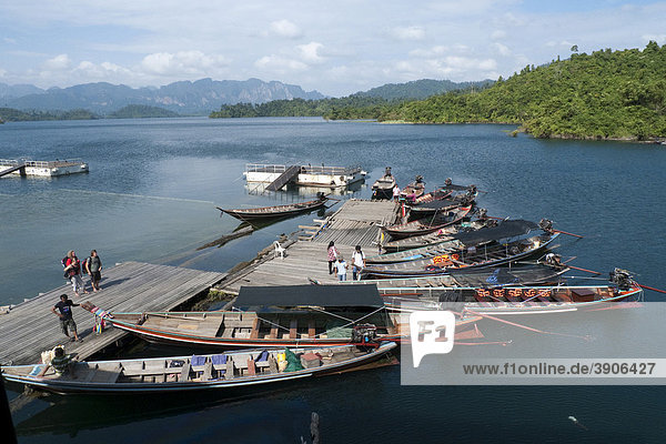 Longtail boats at a jetty near Khao Pang  Khao Sok National Park  man-made reservoir  Chiao Lan Lake  Surat Thani  Thailand  Asia