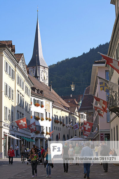 Poststrasse street and church St. Martin  shopping street  street scene  people  Chur  Grisons  Switzerland  Europe