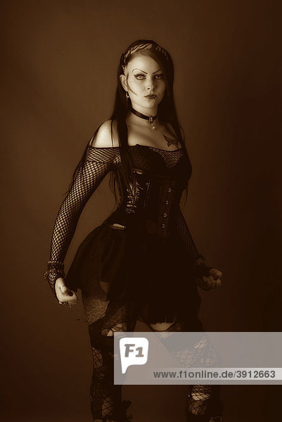 Woman  Gothic style  standing with a serious expression