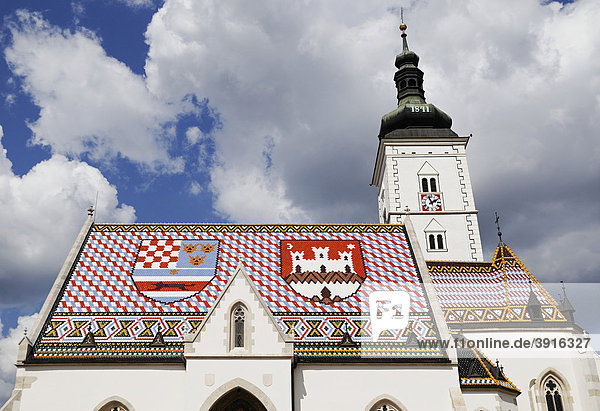 St Marks Church with coat of arms of Zagreb on the right and the shield of the Triune Kingdom of Croatia  Slavonia  and Dalmatia on the left of its tiled roof  Zagreb  Croatia  Europe