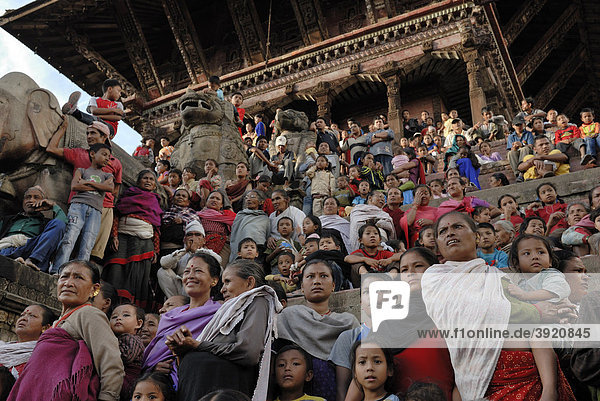 People watching the procession on the steps of the Nyatapola Pagoda  Taumadhi Square  Durbar Square  Bhaktapur  Kathmandu Valley  Nepal  Asia