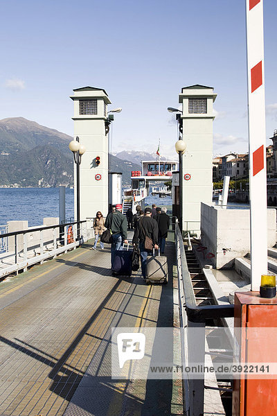 People taking the ferry with suitcases  Bellagio  Lake Como  Italy  Europe
