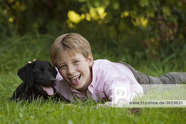 Boy  10  with a labrador puppy
