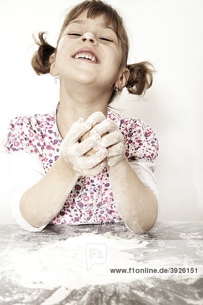 Six-year-old girl baking