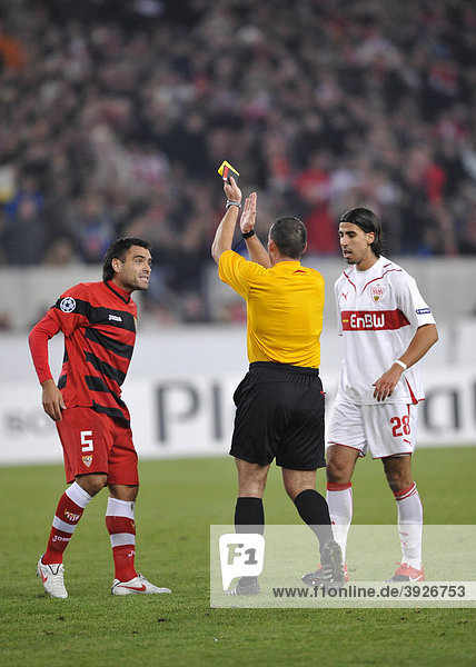 Referee Pieter Vink  Netherlands  showing Aldo Duscher  Sevilla FC  left  a yellow card for handling the ball  right Sami Khedira  VfB Stuttgart football club