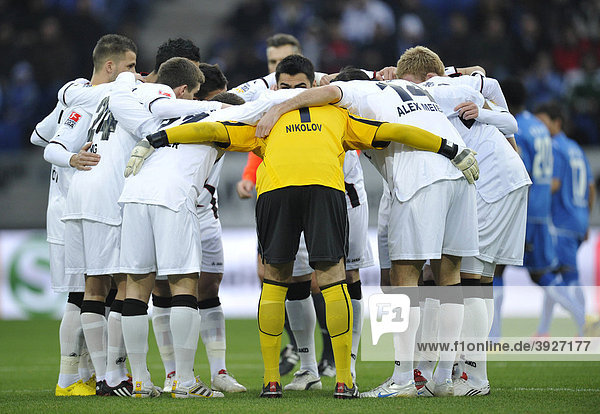 Eintracht Frankfurt football team in a huddle