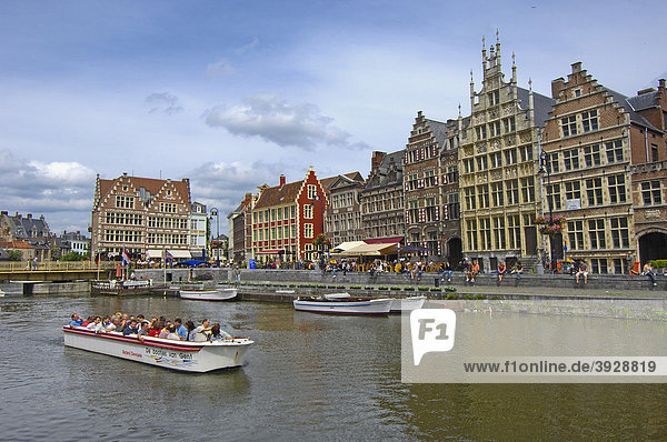 Tourboat and water reflections of the guild houses at Leie River  Ghent  Flanders  Belgium  Europe