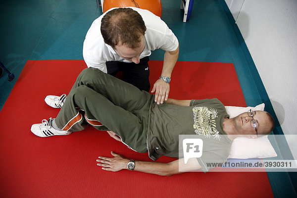 Physiotherapy exercises  mobilisation exercises for encouraging movement  physiotherapy in a neurological rehabilitation centre  Bonn  North Rhine-Westphalia  Germany  Europe