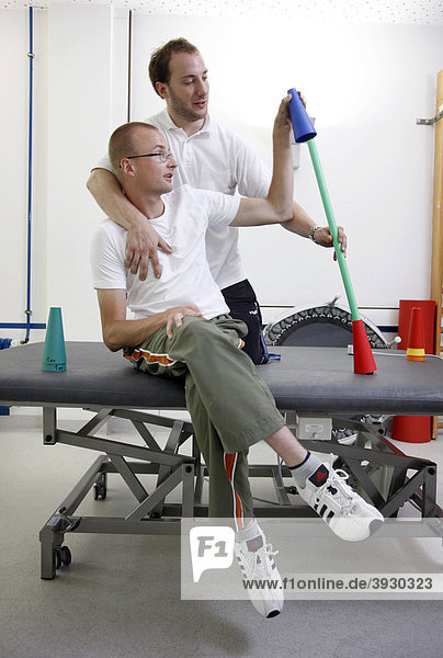Physiotherapy  exercise therapy  muscle strengthening  coordination training in a paralyzed patient  physical therapy in a neurological rehabilitation centre  Bonn  North Rhine-Westphalia  Germany  Europe