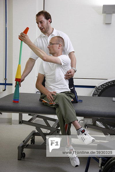 Physiotherapy  exercise therapy  muscle strengthening  coordination training in a paralyzed patient  physical therapy in a neurological rehabilitation centre  Bonn  North Rhine-Westphalia  Germany  Europe