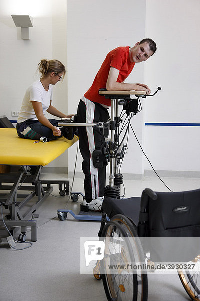 Physiotherapy  exercise therapy  muscle strengthening and coordination training in a special frame for the rehabilitation of paraplegic patients  physiotherapy in neurological rehabilitation centre  Bonn  North Rhine-Westphalia  Germany  Europe