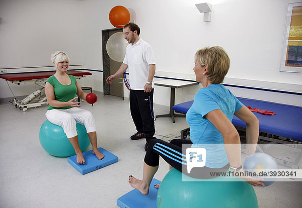 Physiotherapy exercises using exercise balls  physical therapy in a neurological rehabilitation centre  Bonn  North Rhine-Westphalia  Germany  Europe