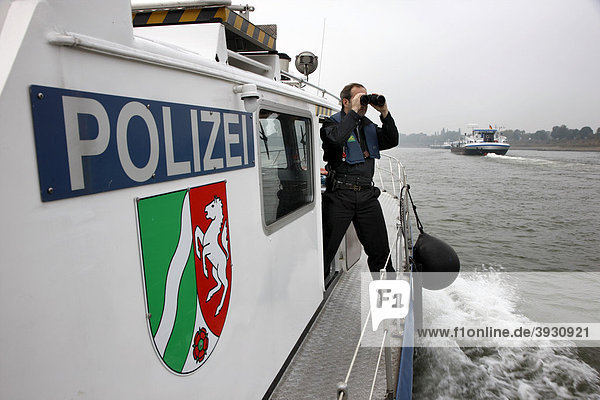 Boat of the water police patrolling on the Rhine river at Duisburg North Rhine-Westphalia Germany Europe