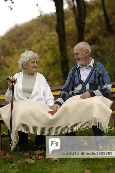 An old couple in a garden