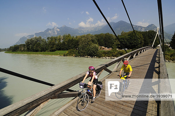 Cyclists on the Rhone bridge  Villeneuve  Vaud  Switzerland  Europe