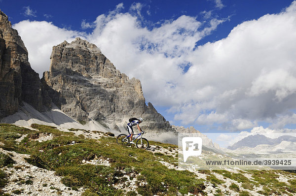 Mountain bike pro Roland Stauder in front of the Tre Cime di Lavaredo  Three Peaks  Alta Pusteria  Dolomites  South Tyrol  Italy  Europe