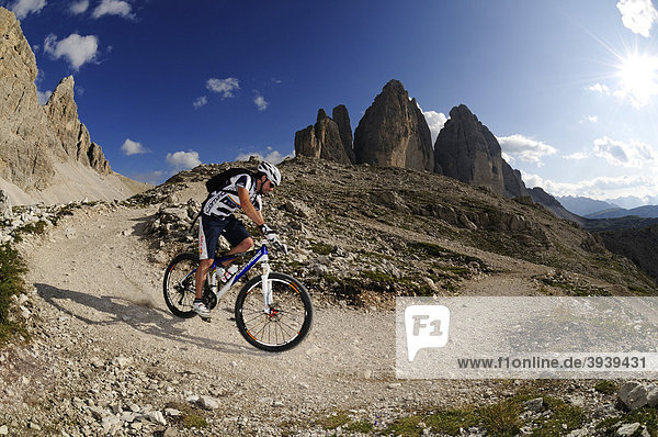 Mountain bike pro Roland Stauder in front of the Tre Cime di Lavaredo  Three Peaks  Alta Pusteria  Dolomites  South Tyrol  Italy  Europe